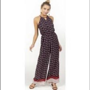 Francesca’s lisbeth Border print jumpsuit